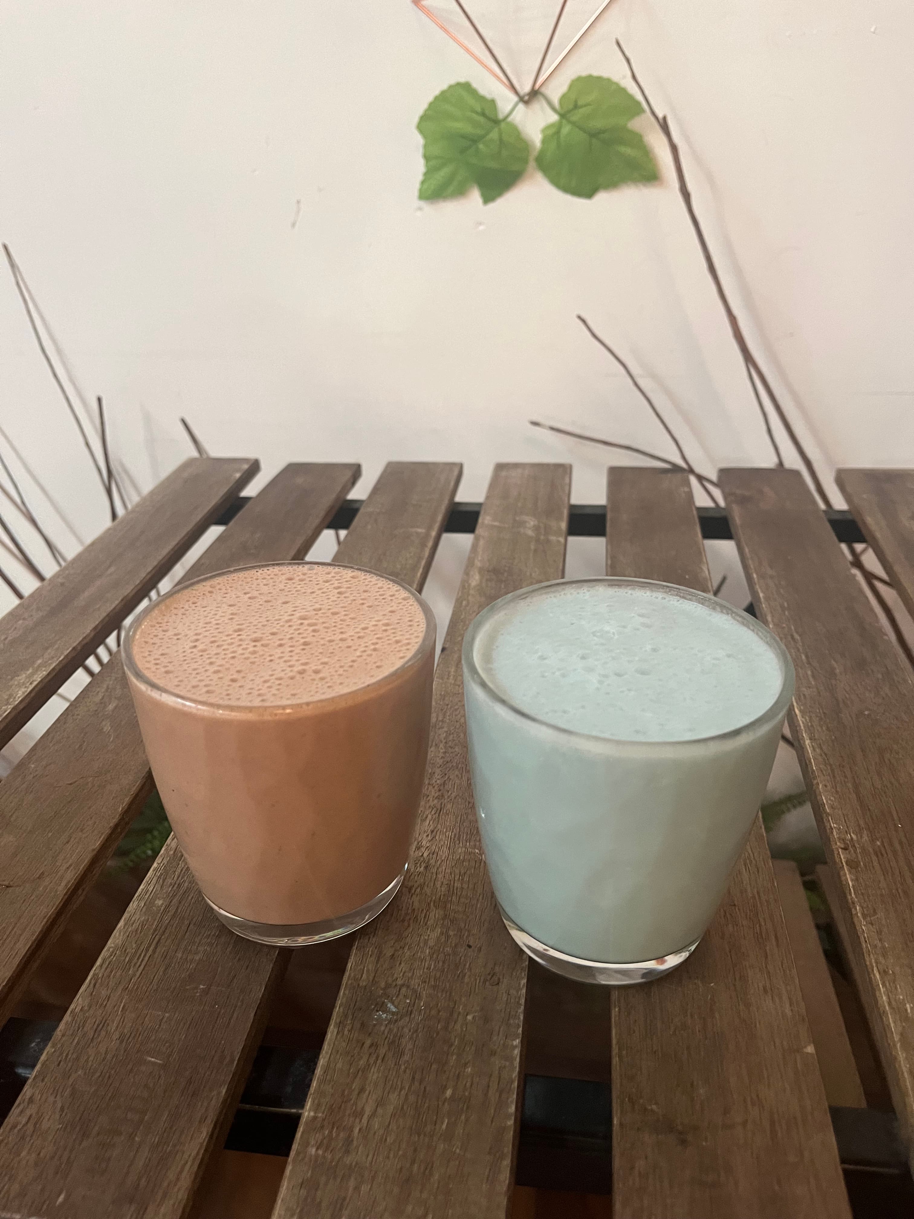 Two café drinks on a wooden table