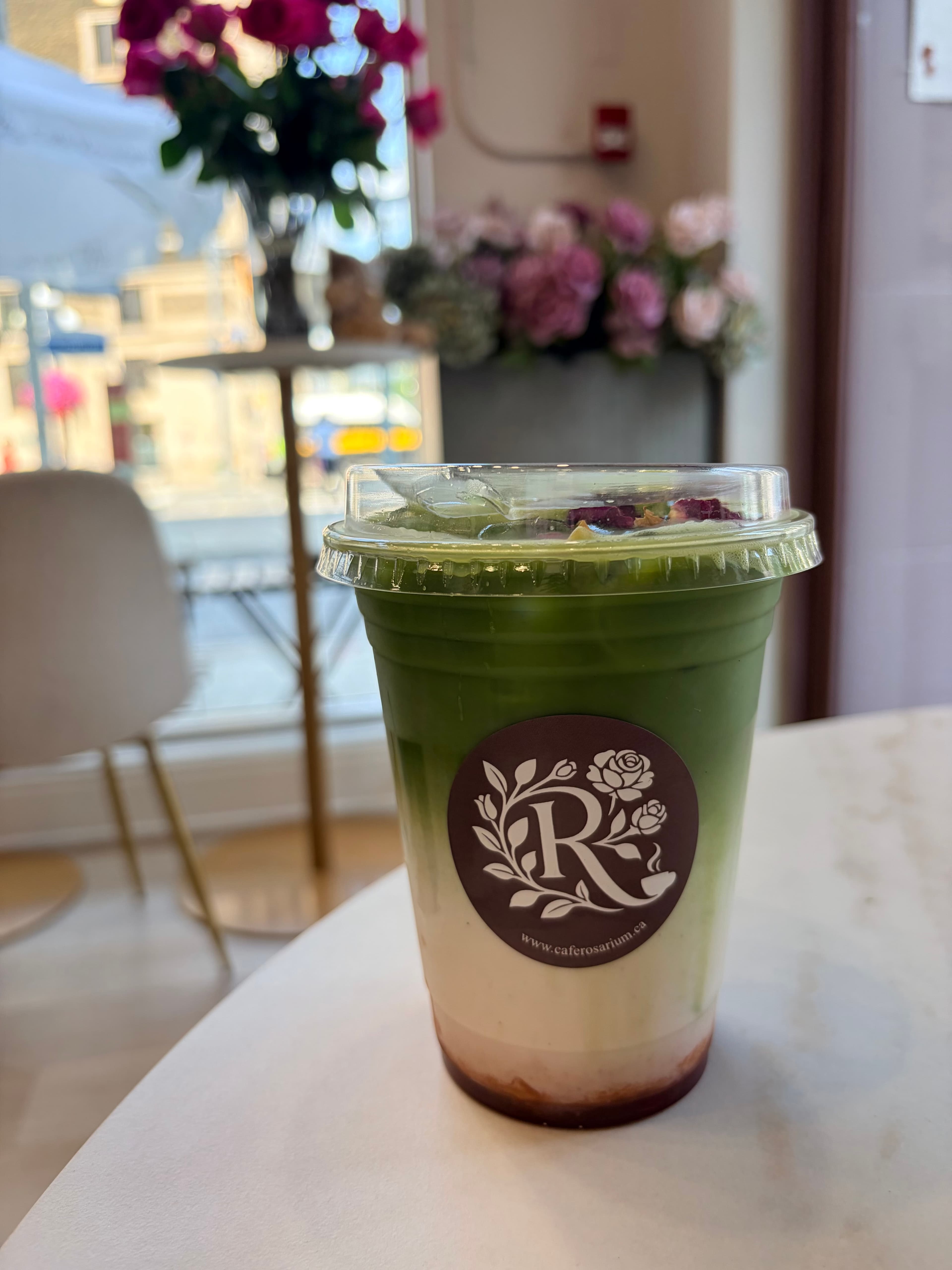Iced matcha latte with rose petals from Café Rosarium