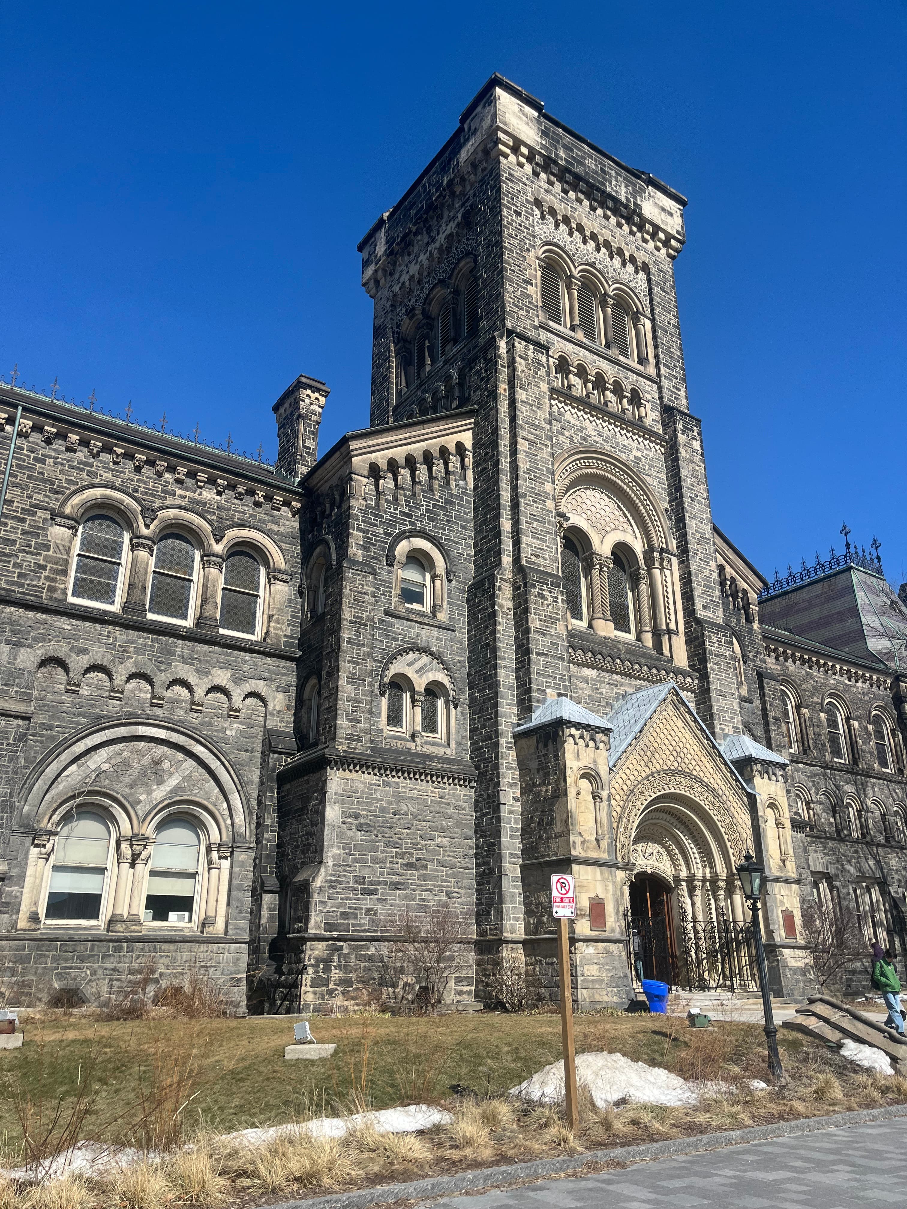 University of Toronto building under a bright blue sky