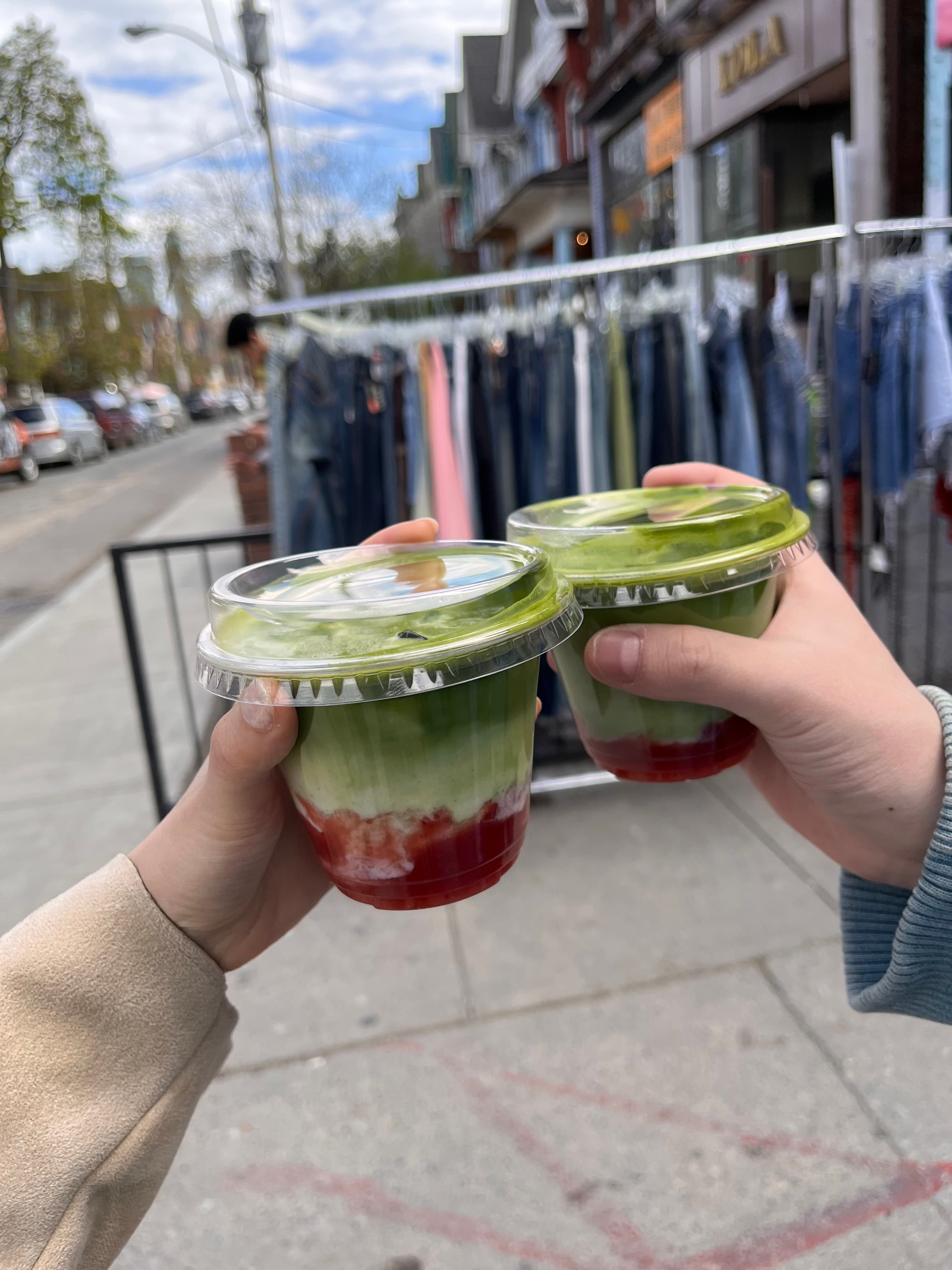 Matcha and strawberry drinks on a Toronto street
